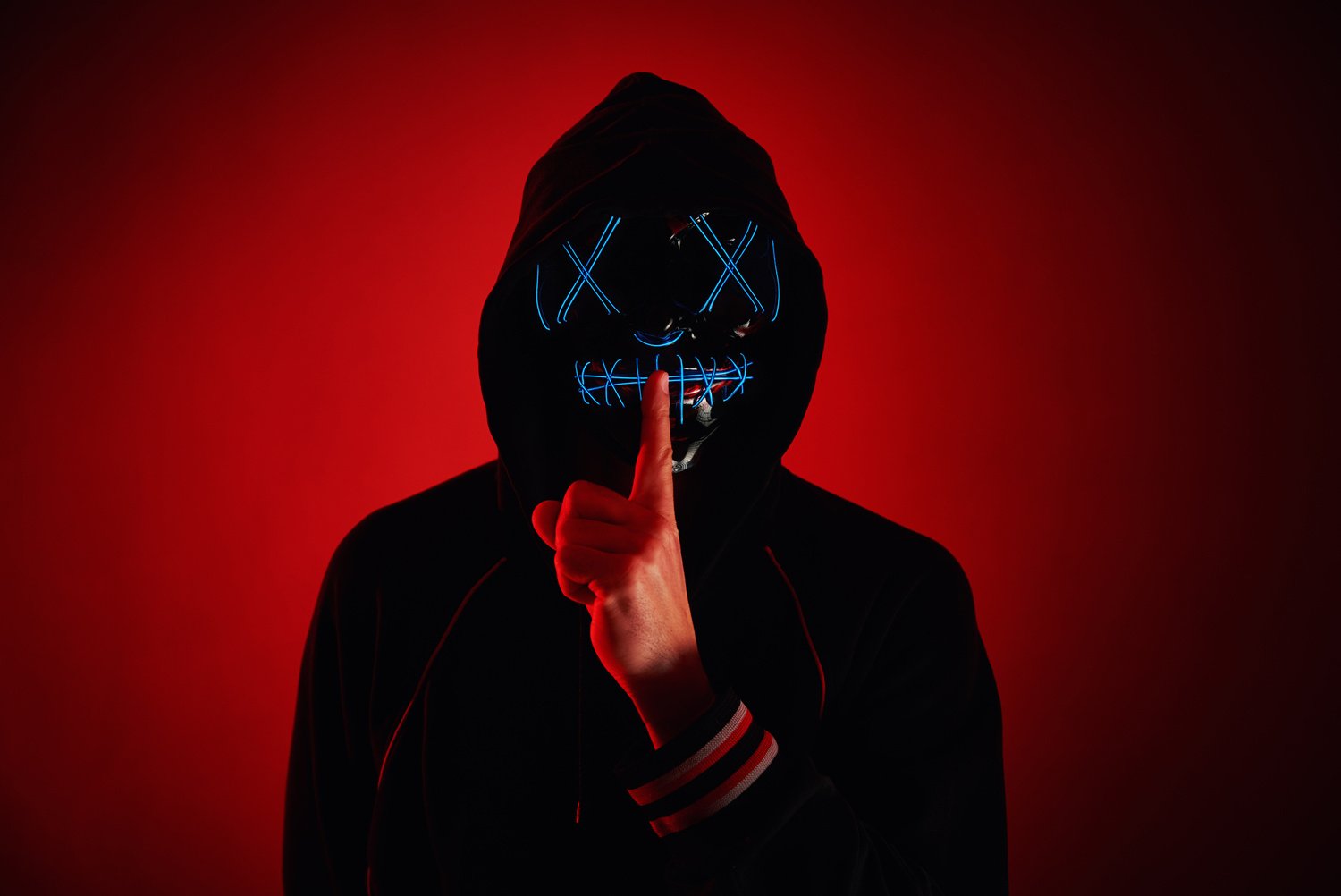 Anonymous Person Doing the Silence Gesture  